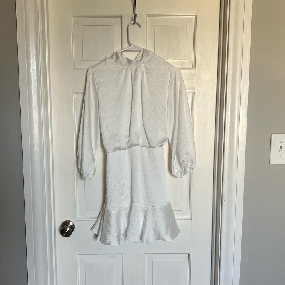 White long sleeve Vici dress. High neck with bow tie on the back.